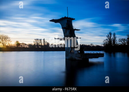 The old diving board at Coate Water in Swindon at dawn. Stock Photo