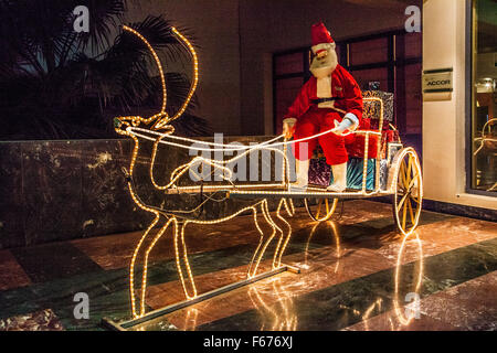 Father Christmas on his sleigh outside a hotel in Dahab, Egypt. Stock Photo