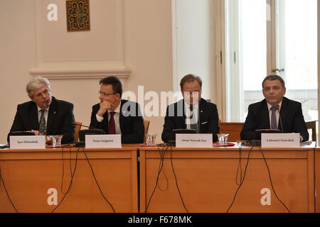 From left to right Slovakian Minister of Foreign and European Affairs Igor Slobodnik, Hungarian Foreign Minister Peter Szijjarto, deputy secretary of state at the Polish Foreign Ministry Artur Nowak-Far and Czech Foreign Minister Lubomir Zaoralek speak to media during the press conference at the Visegrad Four group (V4) and Balkan countries foreign ministers' meeting in Prague, Czech Republic, on Friday, November 13, 2015. Ministers discussed the migration crisis especially. (CTK Photo/Katerina Sulova) Stock Photo