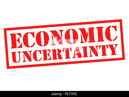 ECONOMIC UNCERTAINTY red Rubber Stamp over a white background. Stock Photo