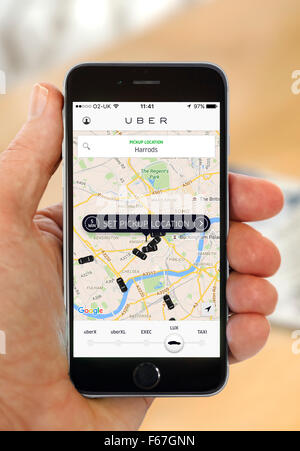 Using the Uber app on an Apple iPhone 6 Stock Photo