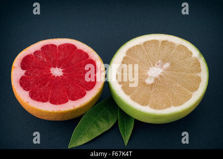Two half of red and white grapefruits. Close up. Stock Photo
