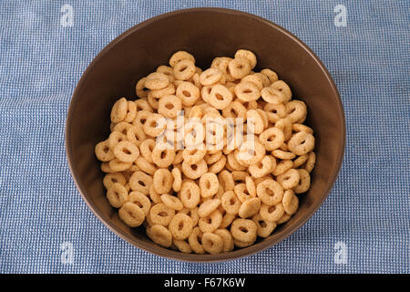 Gluten free whole grain rice and corn cereal loops in a bowl. Stock Photo