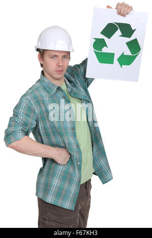 A construction worker promoting recycling. Stock Photo