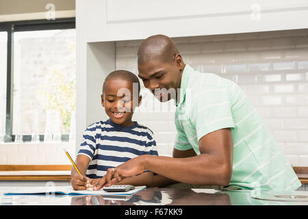 Father helping his son with homework Stock Photo