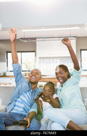 Happy family playing video games Stock Photo