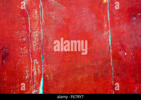 An old and worn red plastered wall Stock Photo