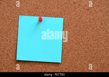 Blank notes pinned into brown corkboard Stock Photo