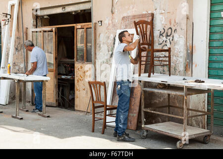 Craftsmen renovate furniture in Palermo, Italy. Stock Photo