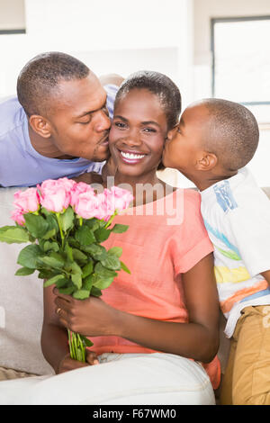 Son surprising mother with flowers Stock Photo