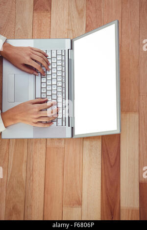 Cropped image of woman using laptop Stock Photo