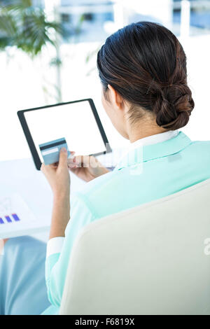 Businesswoman using her tablet pc Stock Photo