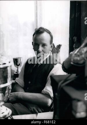1959 - Sitting Amid his Trophies: John Surtees at home. John Surtees, OBE (born 11 February 1934) is a British former Grand Prix motorcycle road racer and Formula One driver © Keystone Pictures USA/ZUMAPRESS.com/Alamy Live News Stock Photo