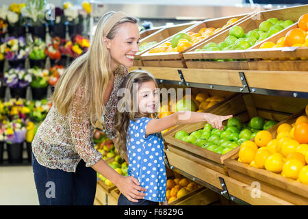 Mother and daughter in grocery shop Stock Photo