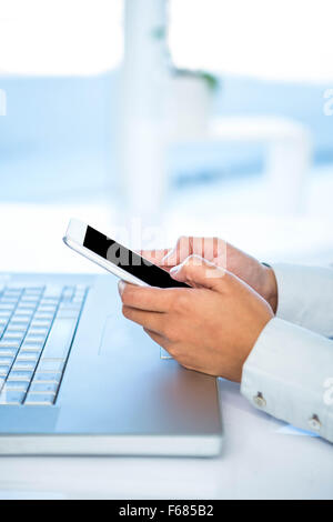 Cropped image of woman using smartphone Stock Photo