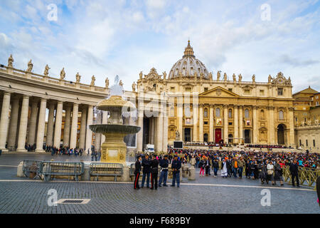 Saint Peter's Square, Vatican City - October 18, 2015 : Tourists and people crowded at Saint Peter's Square in Vatican City on sunday October 18, 2015. Stock Photo