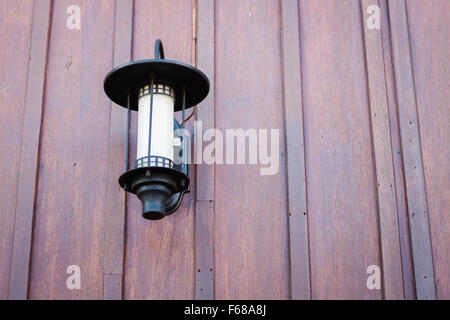Lamp decorated on wooden wall, stock photo Stock Photo