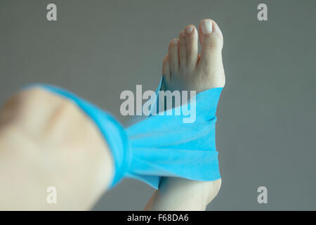 Woman and pilates stretching yoga rubber band strap Stock Photo