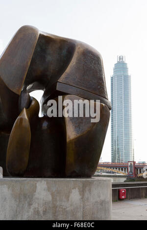 Riverside sculpture with tower block in the background, Millbank, London Stock Photo
