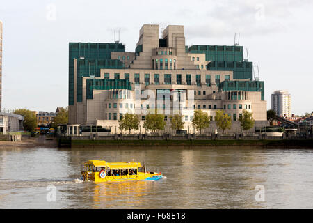 London Duck Tours amphibious vehicle on the river Thames passing the MI6 headquarters, Vauxhall, London Stock Photo