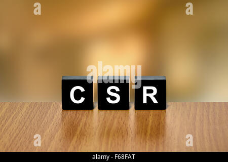 CSR or Corporate social responsibility on black block with blurred background Stock Photo