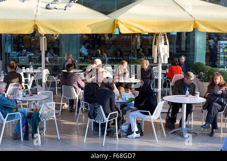 People sitting at tables outside EAT. restaurant, South Bank, London Stock Photo