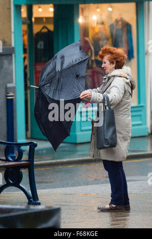 Aberystwyth Wales UK, Saturday 14 November 2015    People struggle avoid getting soaked on the streets of Aberystwyth as a band of torrential rain sweeps in from the west in the wake of Storm Abigail.  Amber and red warnings are in place for the risk of severe flooding in north wales and the north or England, with up to  8” (20cm) of rain forecast to fall on already saturated ground in some areas in the next 24 hours       photo Credit:  Keith Morris /Alamy Live News Stock Photo