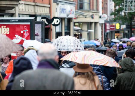 Nottingham, UK. 14th November, 2015. Torrential rain across the East Midlands,shoppers in the centre of Nottingham city brave the downpour. Forecaster's say the rain is to continue for most of the weekend. Credit:  IFIMAGE/Alamy Live News Stock Photo