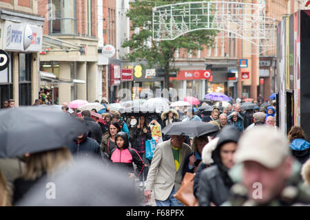 Nottingham, UK. 14th November, 2015. Torrential rain across the East Midlands,shoppers in the centre of Nottingham city brave the downpour. Forecaster's say the rain is to continue for most of the weekend. Credit:  IFIMAGE/Alamy Live News Stock Photo