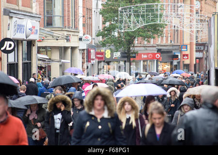 Nottingham, UK. 14th November, 2015. Torrential rain across the East Midlands,shoppers in the centre of Nottingham city brave the downpour. Forecaster's say the rain is to continue for most of the weekend. Credit:  IFIMAGE/Alamy Live News Stock Photo