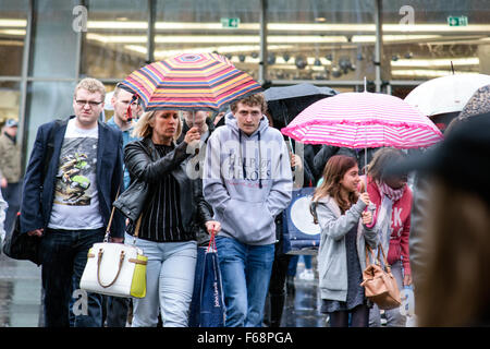 Nottingham, UK. 14th November, 2015. Torrential rain across the East Midlands,shoppers in the centre of Nottingham city brave the downpour. Forecaster's say the rain is to continue for most of the weekend. Credit:  IFIMAGE/Alamy Live News Stock Photo