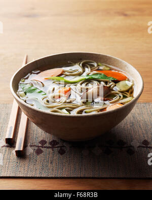 Bowl of hot Asian inspired noodle soup Stock Photo
