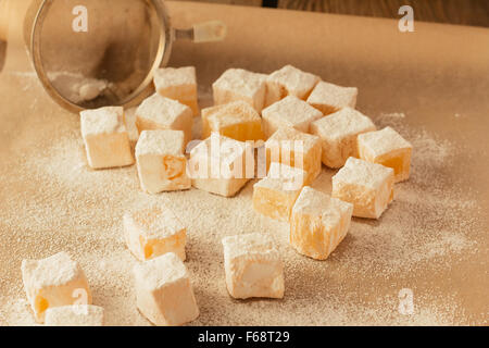 Pieces of turkish delight on cooking sheet selective focus horizontal Stock Photo