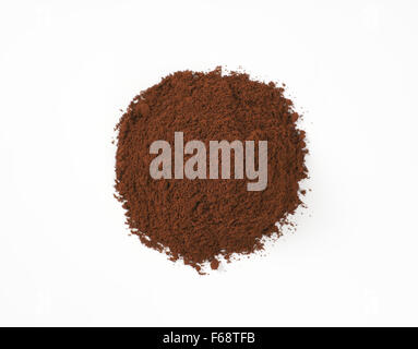 heap of freshly ground coffee on white background Stock Photo