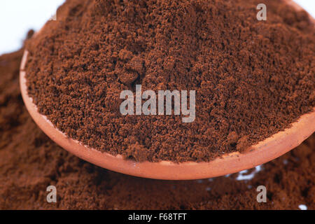 detail of freshly ground coffee in ceramic bowl Stock Photo