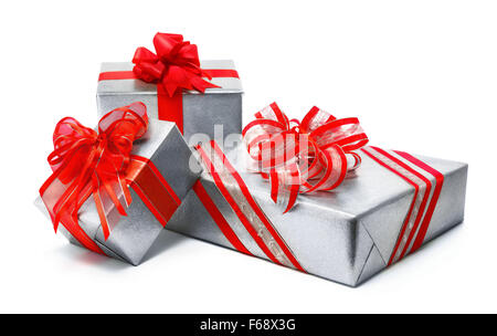 Three silver gift boxes with red ribbon and nice fancy bows, studio isolated on white background Stock Photo