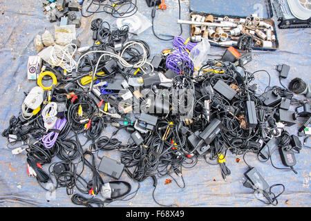 Various used electronic small appliances at the flea market. Stock Photo