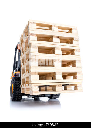 Forklift truck carrying stacked wooden pallets shot on white background Stock Photo