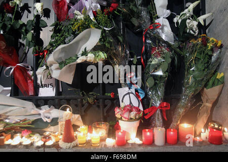 Athens. 14th Nov, 2015. Photo taken on Nov. 14, 2015 shows flowers and candles which Greek people put in front of the Embassy of France in Athens to pay homage to victims of a series of attacks that happened in Paris on Friday night. Credit:  Marios Lolos/Xinhua/Alamy Live News Stock Photo