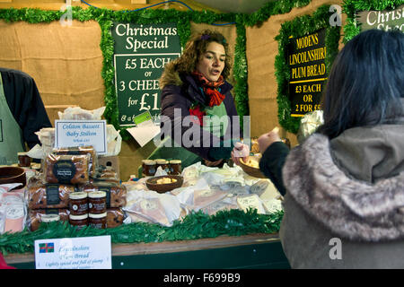 Lincoln, England, Chriskindlemarkt, a food booth selling local and other British cheeses, Lincolnshire Poacher Cheese, Stock Photo