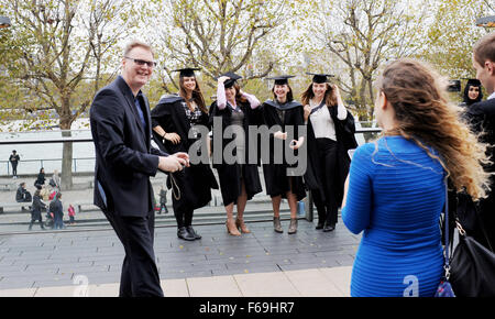 Female students from University of Westminster outside the Royal Festival Hall on the South Bank London after their graduation Stock Photo