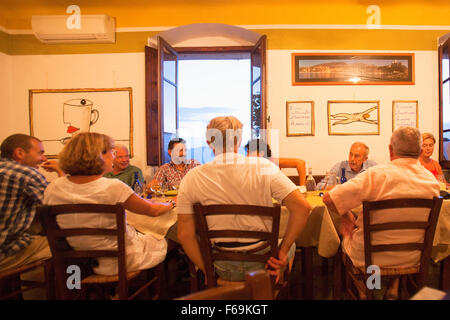 Italy Liguria Lerici - Friends Dining in Osteria L´Orto di Amneste Restaurant Stock Photo