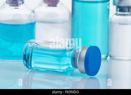 Vial with blue solution close-up. Stock Photo