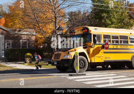A USA school bus stopped to let children off, Salisbury, Connecticut USA Stock Photo