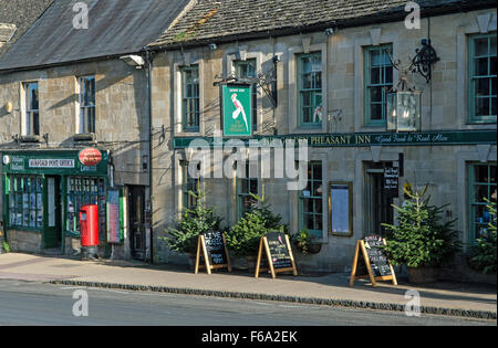 The Golden Pheasant Inn Burford High Street Cotswolds on a bright and sunny day Stock Photo