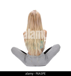 Portrait of young woman meditating in pose of lotus, back view, isolation on white Stock Photo
