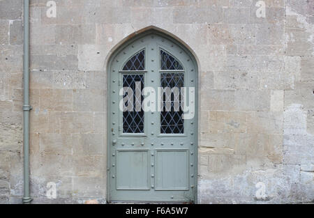 An arched door and doorway set in stone Stock Photo