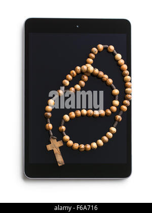 wooden rosary beads with computer tablet on white background Stock Photo
