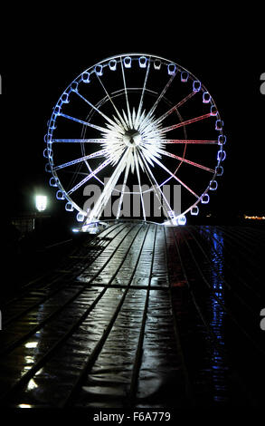 Brighton, UK. 15th Nov, 2015. The Brighton Wheel has been lit up into the red white and blue of the French Tricolor tonight as a mark of a respect to the victims of the Paris killings last Friday Credit:  Simon Dack/Alamy Live News Stock Photo