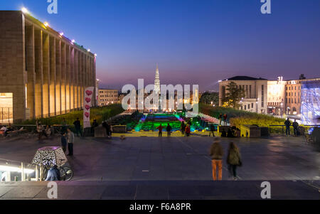 View of Mont des Arts / Kunstberg park in Brussels just after sunset. In the background city buildings and the town hall belfry. Stock Photo